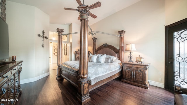 bedroom with ceiling fan, high vaulted ceiling, and dark wood-type flooring