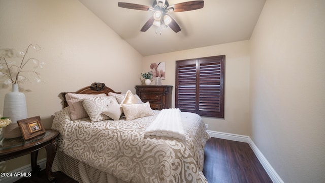 bedroom featuring ceiling fan, dark wood-type flooring, and vaulted ceiling