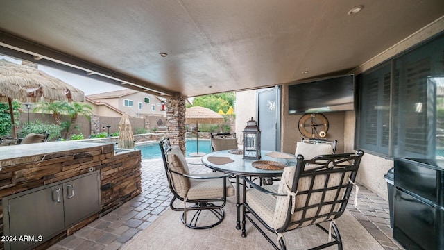 view of patio / terrace featuring a fenced in pool