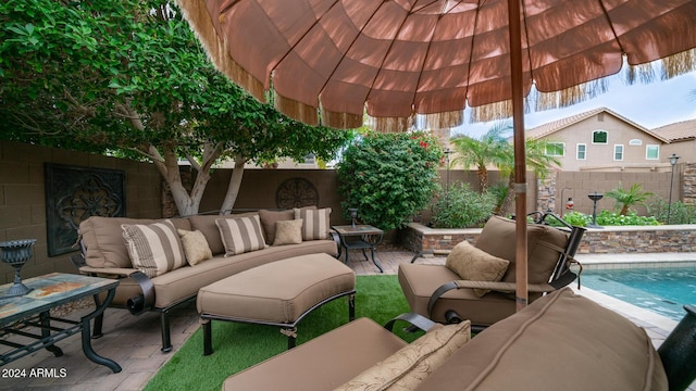 view of patio / terrace with outdoor lounge area and a fenced in pool