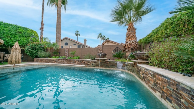 view of swimming pool featuring pool water feature