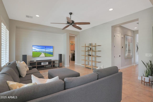 living room with ceiling fan, baseboards, light tile patterned flooring, and recessed lighting