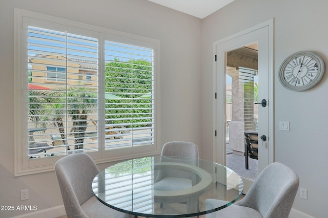 dining space featuring baseboards