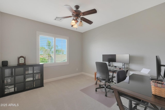 carpeted office featuring ceiling fan and baseboards