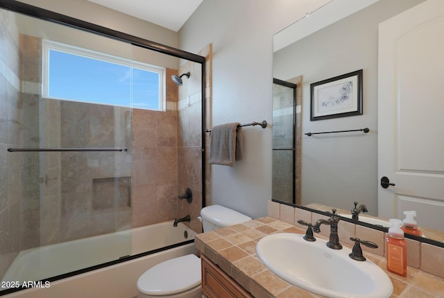 full bathroom with toilet, shower / bath combination with glass door, and vanity