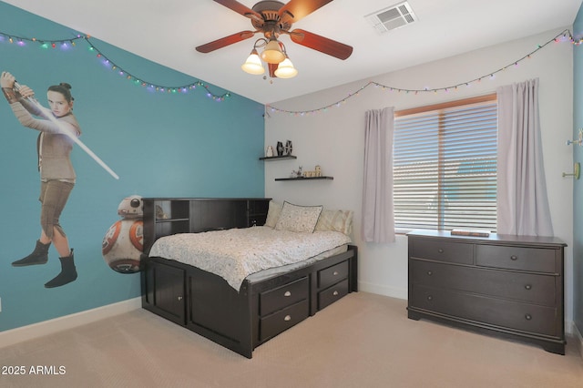 carpeted bedroom with baseboards and a ceiling fan