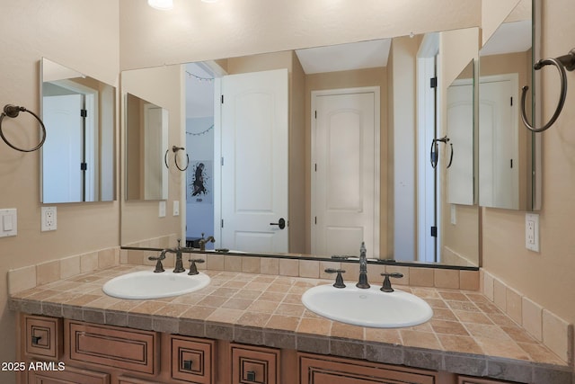 full bathroom featuring double vanity