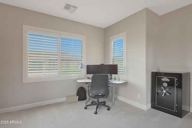 home office featuring carpet floors, baseboards, and healthy amount of natural light