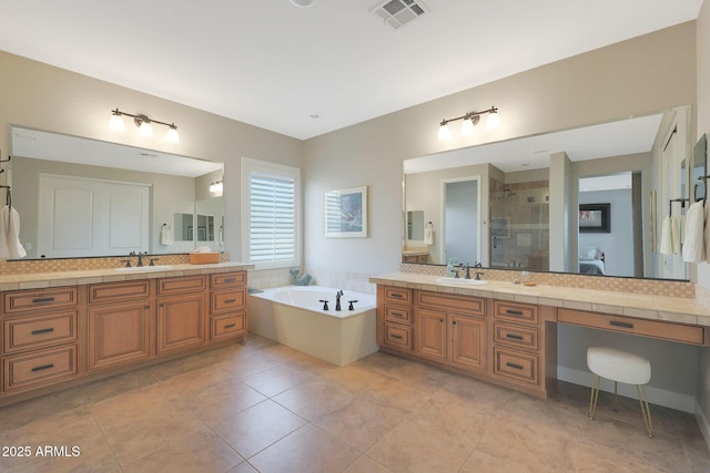 full bath with a shower stall, a bath, backsplash, and two vanities