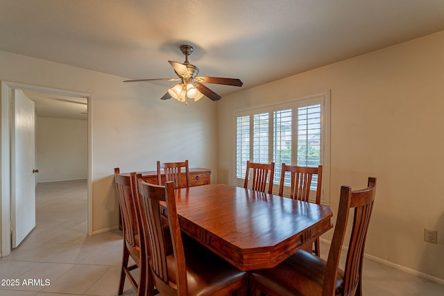 dining space with light tile patterned floors and ceiling fan