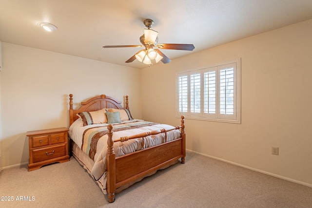 bedroom featuring light carpet and ceiling fan