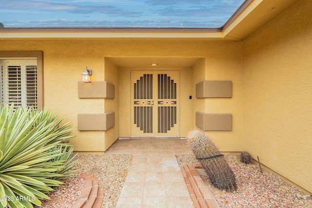 entrance to property with a patio