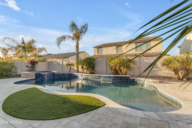 view of swimming pool featuring an in ground hot tub