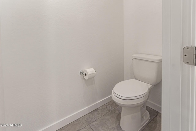 bathroom featuring tile patterned floors and toilet