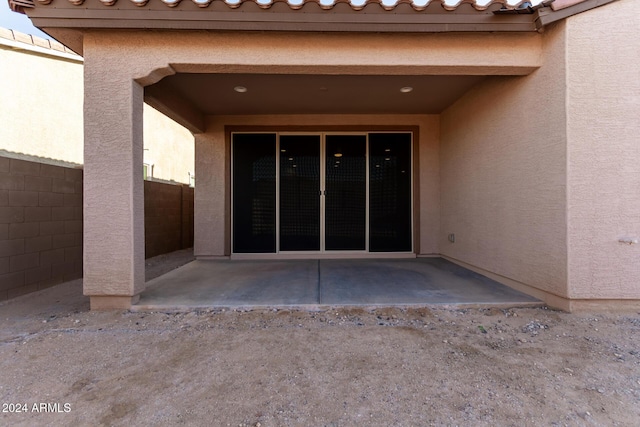 doorway to property featuring a patio