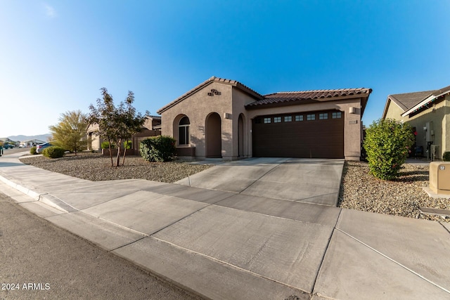 mediterranean / spanish-style house featuring a garage