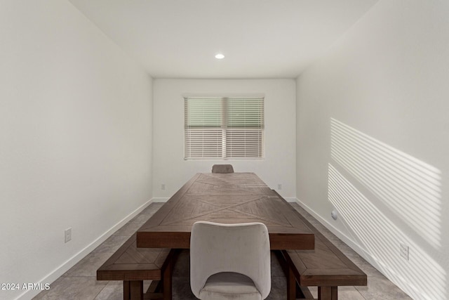 dining space featuring tile patterned flooring