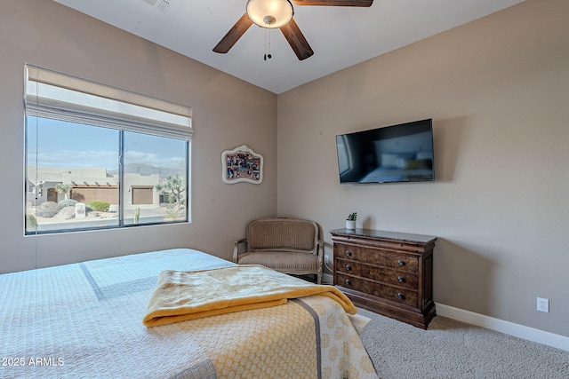 bedroom featuring carpet floors, baseboards, and a ceiling fan