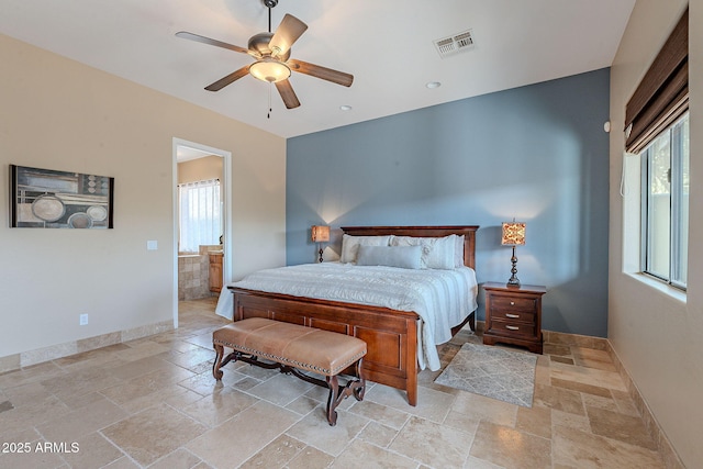 bedroom featuring baseboards, multiple windows, visible vents, and stone tile floors