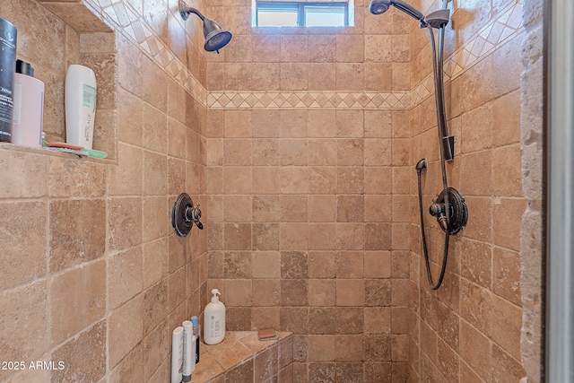 bathroom with a tile shower