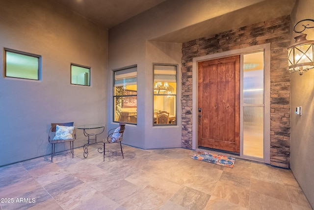 doorway to property with a patio area