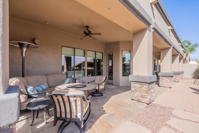 view of patio / terrace featuring a ceiling fan and an outdoor living space