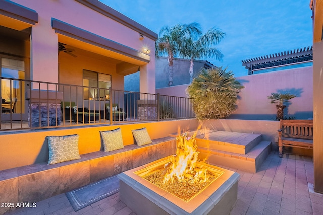 view of patio featuring an outdoor fire pit