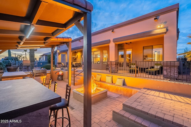 view of patio featuring a fire pit