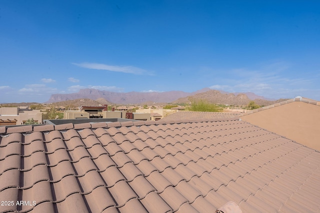 exterior details with a mountain view and a tiled roof