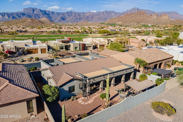 drone / aerial view with a residential view and a mountain view