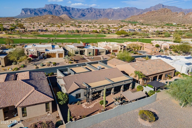 drone / aerial view featuring a residential view and a mountain view