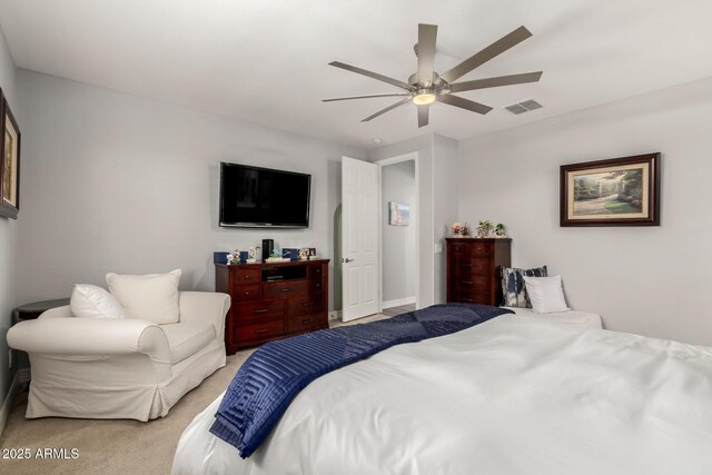bedroom featuring light carpet, ceiling fan, and baseboards