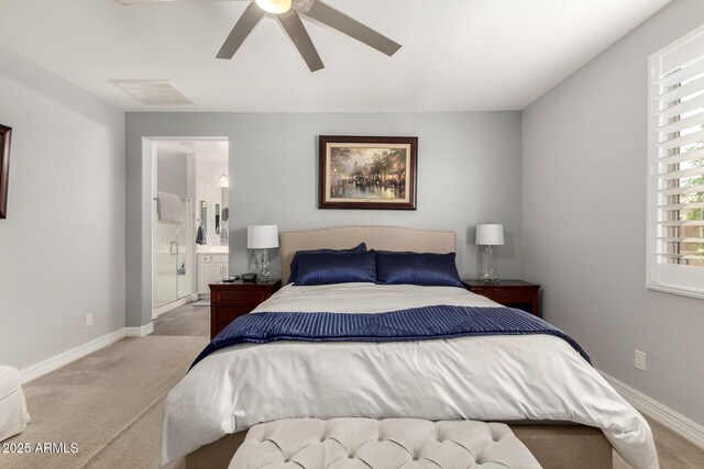 bedroom featuring carpet floors, baseboards, a ceiling fan, and ensuite bathroom