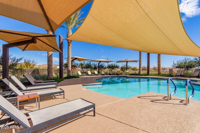 view of pool featuring a patio area and fence