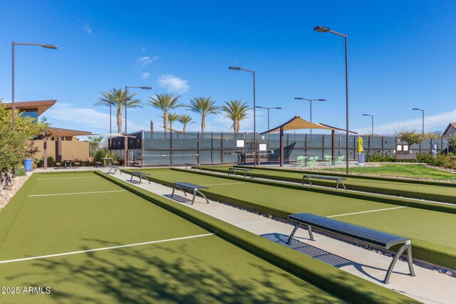 surrounding community with a game area and fence