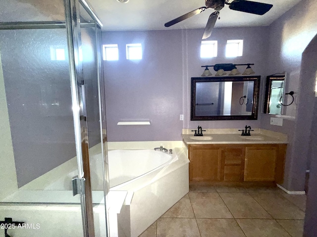 bathroom with double vanity, a sink, a shower stall, tile patterned flooring, and a bath