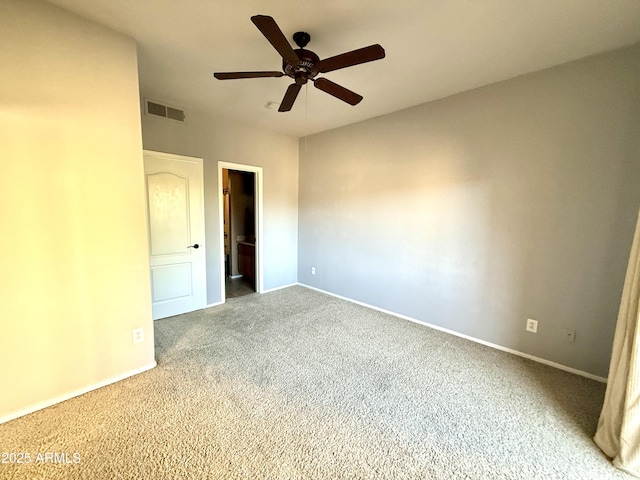 unfurnished bedroom featuring carpet floors, baseboards, visible vents, and ceiling fan