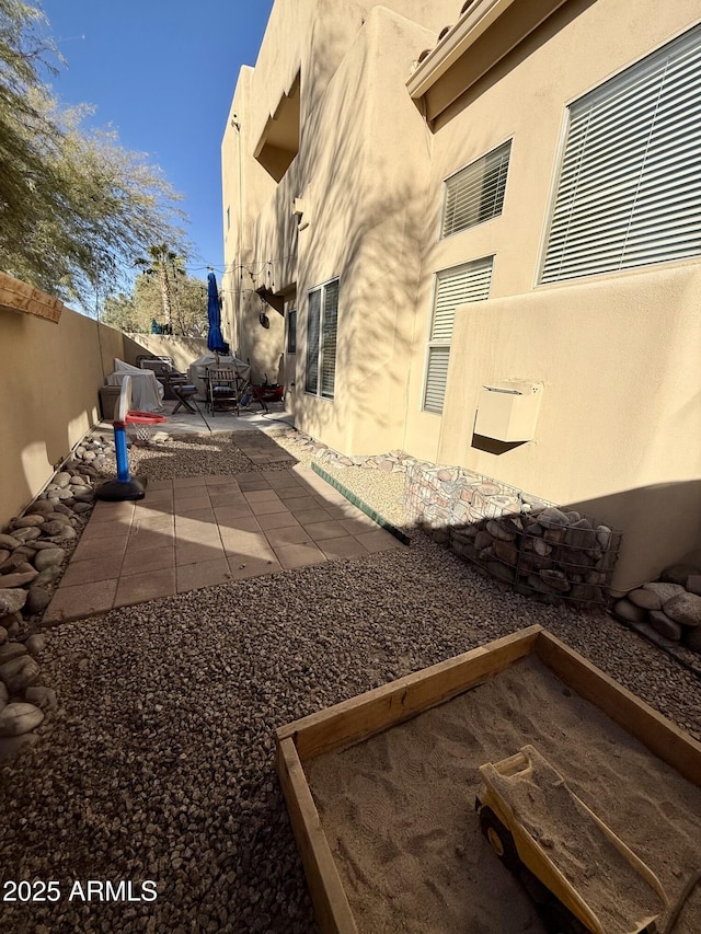 view of yard with a fenced backyard and a patio