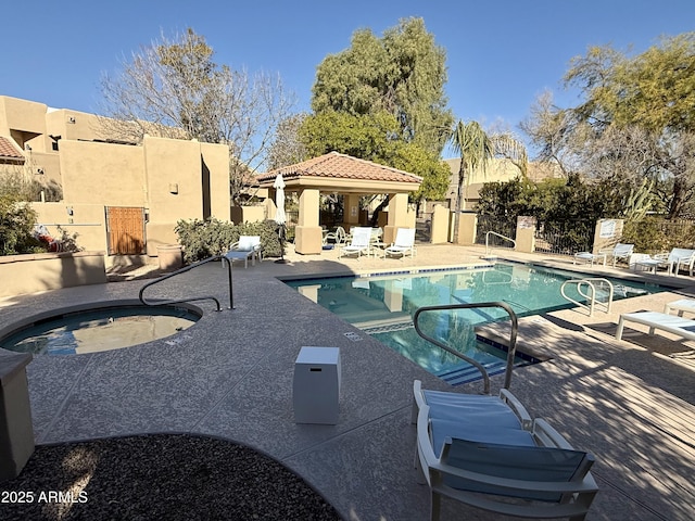 pool featuring a gazebo, a patio, and fence