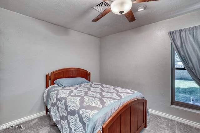 bedroom featuring baseboards, ceiling fan, carpet flooring, and visible vents