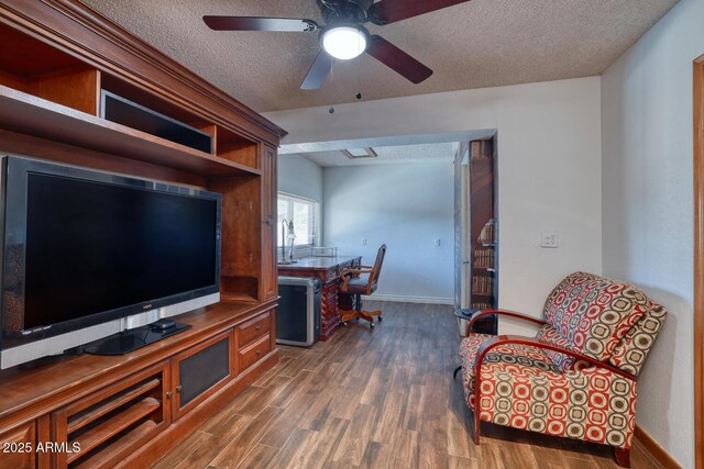 home office with baseboards, a textured ceiling, ceiling fan, and wood finished floors