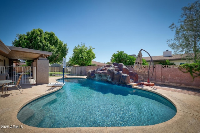 view of swimming pool with fence, a fenced in pool, and a patio
