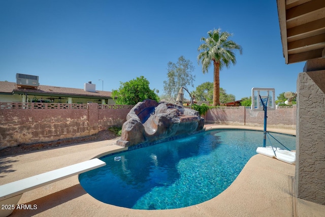 view of swimming pool with a fenced backyard, a fenced in pool, and a patio area