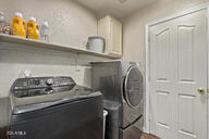 28422 N 32nd Ln, Phoenix, AZ 85083 - laundry room with washing machine and dryer and cabinet space