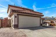 28422 N 32nd Ln, Phoenix, AZ 85083 - view of home's exterior with driveway, an attached garage, and fence