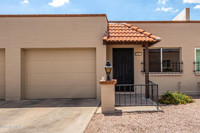 440 S Parkcrest Unit 145, Mesa, AZ 85206 - view of front of house with a tiled roof, driveway, and a garage