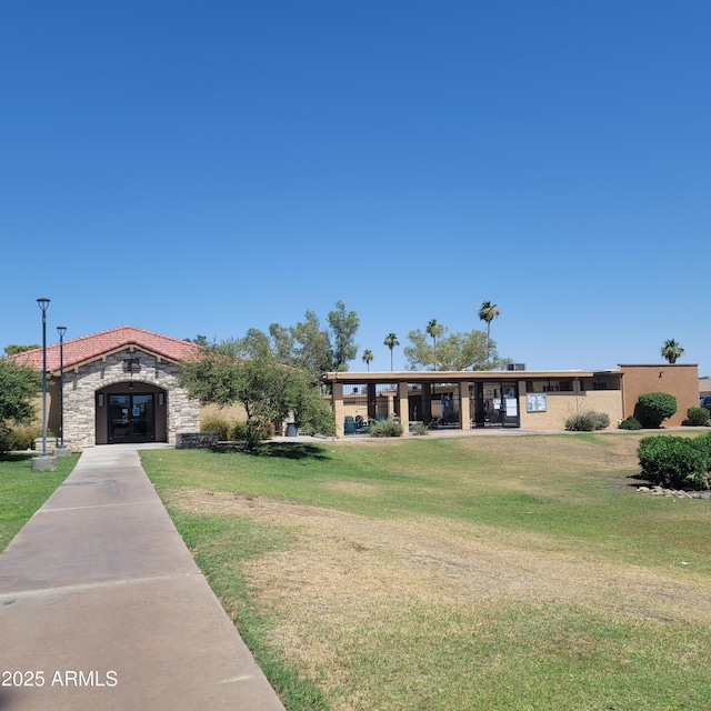 440 S Parkcrest Unit 145, Mesa, AZ 85206 - view of front of property with stone siding, a front lawn, and stucco siding