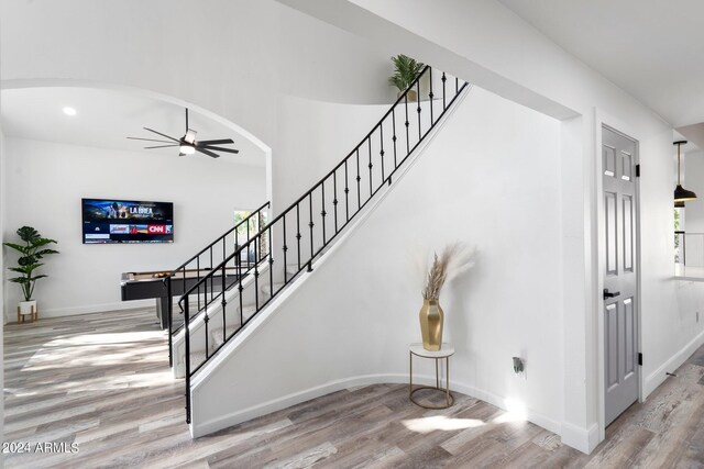 2818 N Yucca St, Chandler, AZ 85224 - stairs with a ceiling fan, wood finished floors, baseboards, arched walkways, and recessed lighting
