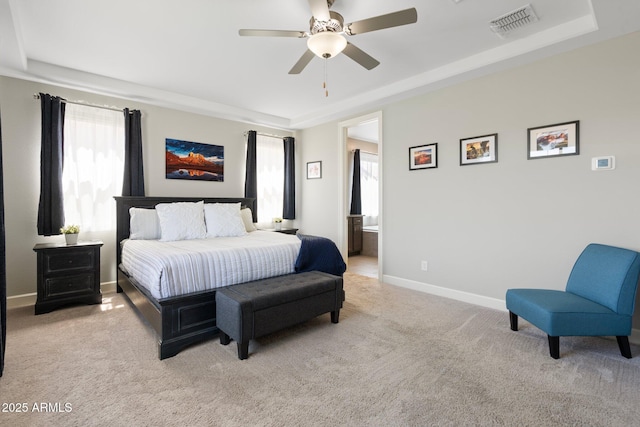 15663 S 183rd Dr, Goodyear, AZ 85338 - bedroom with light carpet, a tray ceiling, visible vents, and baseboards
