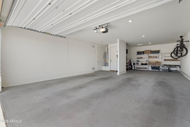 15663 S 183rd Dr, Goodyear, AZ 85338 - garage with a garage door opener, gas water heater, and recessed lighting